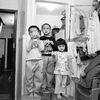 Photographer Thomas Holton Has Spent 15 Years Documenting One Family Living In A Tiny Chinatown Apartment  